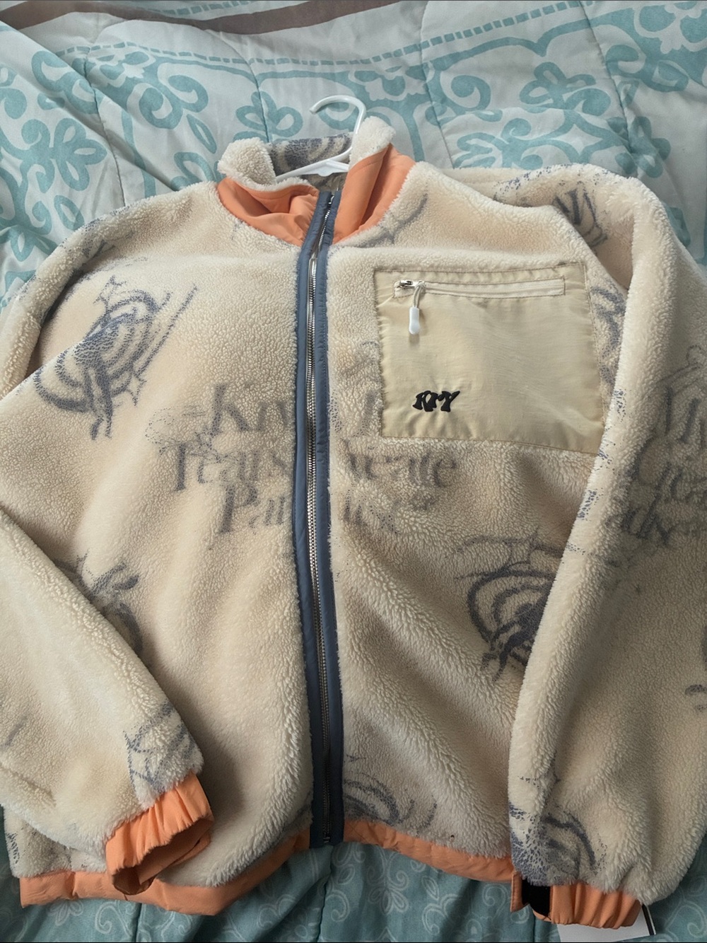 Roxy Cream Fleece Jacket with Light Blue Trim and Orange Cuffs